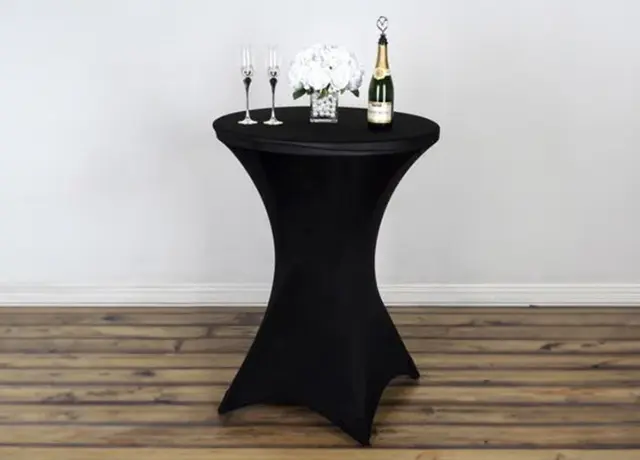 A table with champagne and two wine glasses on top of it.